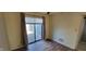 Well-lit bedroom with modern flooring and sliding door access to the outdoors at 4969 Fairway Dr, Avon, IN 46123