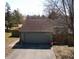 A partial view of the exterior of the house showing a garage with a driveway at 4969 Fairway Dr, Avon, IN 46123