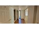 Inviting hallway featuring wood-look floors and access to various rooms, creating a seamless transition throughout the home at 4969 Fairway Dr, Avon, IN 46123