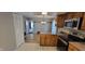 Well-lit kitchen featuring modern stainless steel appliances and wood cabinets at 4969 Fairway Dr, Avon, IN 46123