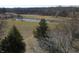 Scenic landscape view showcasing a tranquil pond and lush greenery at 4969 Fairway Dr, Avon, IN 46123