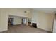 Cozy living room with a fireplace, high ceiling, ceiling fan and neutral carpet, perfect for relaxation at 4969 Fairway Dr, Avon, IN 46123