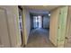 View of a living room with a sliding glass door leading to a deck or patio, open to the entry at 4969 Fairway Dr, Avon, IN 46123