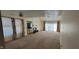 Spacious living room featuring a fireplace, ceiling fan, and sliding glass door, perfect for indoor-outdoor living at 4969 Fairway Dr, Avon, IN 46123