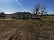 View of the backyard showing the property's large yard space and a sense of the surrounding neighborhood at 5061 N 200 W, Columbus, IN 47201