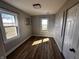 Bright bedroom featuring hardwood floors, neutral wall color, and windows providing ample natural light at 5061 N 200 W, Columbus, IN 47201