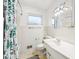 Bright bathroom featuring a shower/tub combo with a Christmas-themed curtain at 5108 Chatham Pl, Indianapolis, IN 46226