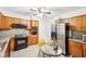 Functional kitchen features neutral countertops, and stainless steel refrigerator at 5108 Chatham Pl, Indianapolis, IN 46226