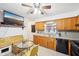 Well-lit kitchen featuring neutral countertops, plenty of cabinets, and eat-in dining area at 5108 Chatham Pl, Indianapolis, IN 46226