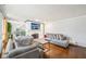 Bright living room featuring a white brick fireplace and hardwood floors, perfect for entertaining guests at 5108 Chatham Pl, Indianapolis, IN 46226