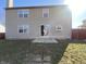 Two-story home with sliding glass door onto patio and grassy backyard at 518 Waterford Way, Danville, IN 46122