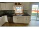 Updated kitchen featuring white cabinets, stainless steel appliances, stylish backsplash, and modern fixtures at 518 Waterford Way, Danville, IN 46122