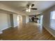 Expansive living room showcasing hardwood floors, open layout, a ceiling fan, and natural light at 518 Waterford Way, Danville, IN 46122