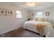 Sunlit bedroom featuring a comfortable bed, neutral walls, and stylish decor at 518 Wedgewood Dr, Anderson, IN 46013