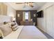 Relaxing bedroom features neutral tones, a ceiling fan, and an entertainment center at 518 Wedgewood Dr, Anderson, IN 46013