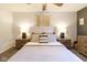 This primary bedroom boasts a comfortable bed, ceiling fan, and neutral decor at 518 Wedgewood Dr, Anderson, IN 46013
