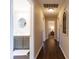 Spacious hallway leads to an updated bathroom with dual sinks and bedrooms at 518 Wedgewood Dr, Anderson, IN 46013