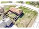 Aerial view of a home with a fenced backyard, mature trees, and well-maintained landscaping in a suburban neighborhood at 5414 Honey Comb Ln, Indianapolis, IN 46221