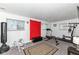 Well-lit basement with exercise equipment, offering a functional space for fitness and recreation with finished carpeted floors at 5414 Honey Comb Ln, Indianapolis, IN 46221