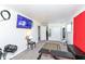 Spacious basement includes exercise equipment, providing a versatile area for workouts with ample lighting and tv at 5414 Honey Comb Ln, Indianapolis, IN 46221