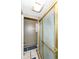 Bathroom featuring a glass-enclosed shower with brass trim and a tiled floor, offering a functional space at 5414 Honey Comb Ln, Indianapolis, IN 46221