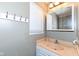 Bathroom featuring a vanity with a sink, a mirrored cabinet, and a set of hooks, blending utility and function at 5414 Honey Comb Ln, Indianapolis, IN 46221