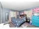 Charming bedroom with colorful décor, carpet flooring and bright windows offering natural light at 5414 Honey Comb Ln, Indianapolis, IN 46221