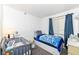 A bedroom with a crib, bed, and lots of natural light, creating a cozy and inviting space at 5414 Honey Comb Ln, Indianapolis, IN 46221