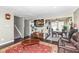 Open living area with staircase and access to the kitchen and dining area at 5414 Honey Comb Ln, Indianapolis, IN 46221