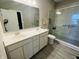 Stylish bathroom featuring a glass walk-in shower, double sink vanity, and sleek modern design elements at 6480 E Walton Dr, Camby, IN 46113