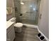 Modern bathroom featuring a sleek glass-enclosed shower, updated fixtures, and a gray vanity at 6480 E Walton Dr, Camby, IN 46113