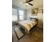 Cozy bedroom with natural light, ceiling fan, and calm decor at 6480 E Walton Dr, Camby, IN 46113