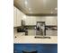Modern kitchen with quartz countertops, stainless steel appliances, and ample white cabinetry for storage at 6480 E Walton Dr, Camby, IN 46113