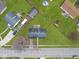 Aerial view of a single-Gathering home with a large, well-maintained yard at 702 Eberhart Dr, Shelbyville, IN 46176