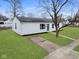 Front exterior of home with nice green grass at 702 Eberhart Dr, Shelbyville, IN 46176