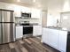 Modern kitchen with stainless steel appliances and granite countertops at 702 Eberhart Dr, Shelbyville, IN 46176