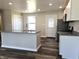 Modern kitchen with stainless steel appliances, granite countertops and kitchen island at 702 Eberhart Dr, Shelbyville, IN 46176