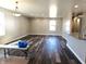 Spacious living room with hardwood floors and bright natural light at 702 Eberhart Dr, Shelbyville, IN 46176