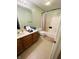 Standard bathroom featuring a vanity with sink, toilet, shower-tub combo with curtain, and tiled floor at 734 W 9Th St, Greenfield, IN 46140