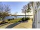 Landscaped backyard with water views, perfect for outdoor enjoyment and relaxation at 7780 Paw Paw Dr, Nineveh, IN 46164