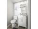 Charming powder room with elegant vanity, contemporary fixtures, and a clean, stylish design at 7780 Paw Paw Dr, Nineveh, IN 46164
