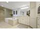 Elegant bathroom featuring a soaking tub, separate shower, and dual vanities, creating a relaxing and functional space at 7780 Paw Paw Dr, Nineveh, IN 46164