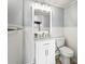 Clean bathroom featuring a white vanity with marble countertop and modern fixtures at 7780 Paw Paw Dr, Nineveh, IN 46164