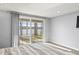 Bright bedroom with a large sliding glass door and lake view, providing plenty of natural light and scenic beauty at 7780 Paw Paw Dr, Nineveh, IN 46164