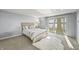 Comfortable bedroom with sliding glass door, carpet, and cozy decor offers a relaxing retreat at 7780 Paw Paw Dr, Nineveh, IN 46164
