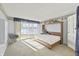 Bright bedroom with lake views, a murphy bed and natural light at 7780 Paw Paw Dr, Nineveh, IN 46164