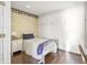 Cozy bedroom features hardwood floors, neutral walls, and built-in white cabinets at 7780 Paw Paw Dr, Nineveh, IN 46164