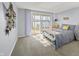 Bedroom with water view features a large sliding glass door for lots of natural light at 7780 Paw Paw Dr, Nineveh, IN 46164