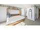 Charming bedroom with a view to the ensuite bathroom and nautical themed decor at 7780 Paw Paw Dr, Nineveh, IN 46164