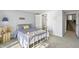 Bright bedroom has a full size bed and en-suite bathroom, and overlooks the stairway at 7780 Paw Paw Dr, Nineveh, IN 46164